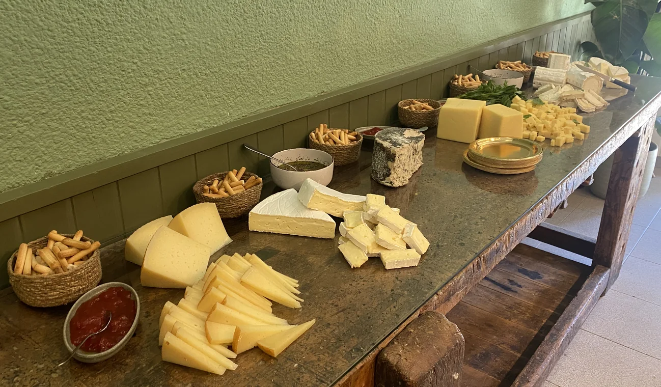 Cheese, bread and sides laid out during the Le Bistrot launch event