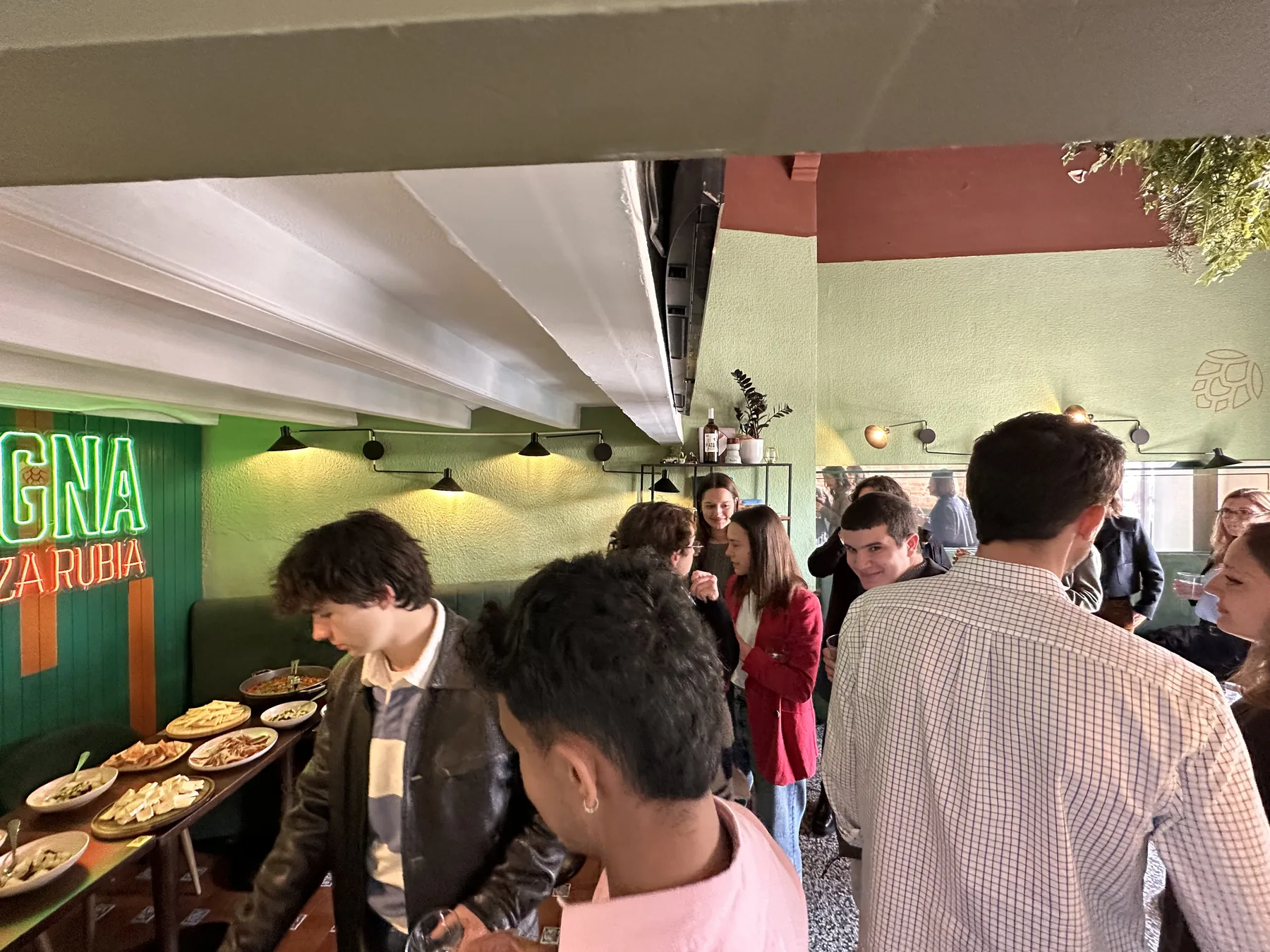 Le Bistrot dining room full of guests and shared plates